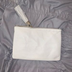 White clutch with tassel